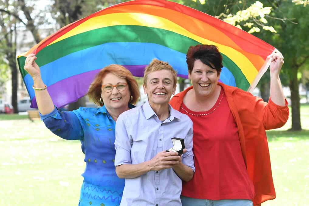 WE'RE GETTING MARRIED: Orange Hospital Auxiliary president Tracy Wilkinson with the happy couple Leanne Benson and Cathryn Meagher. Photo: JUDE KEOGH 0321jkmarry2