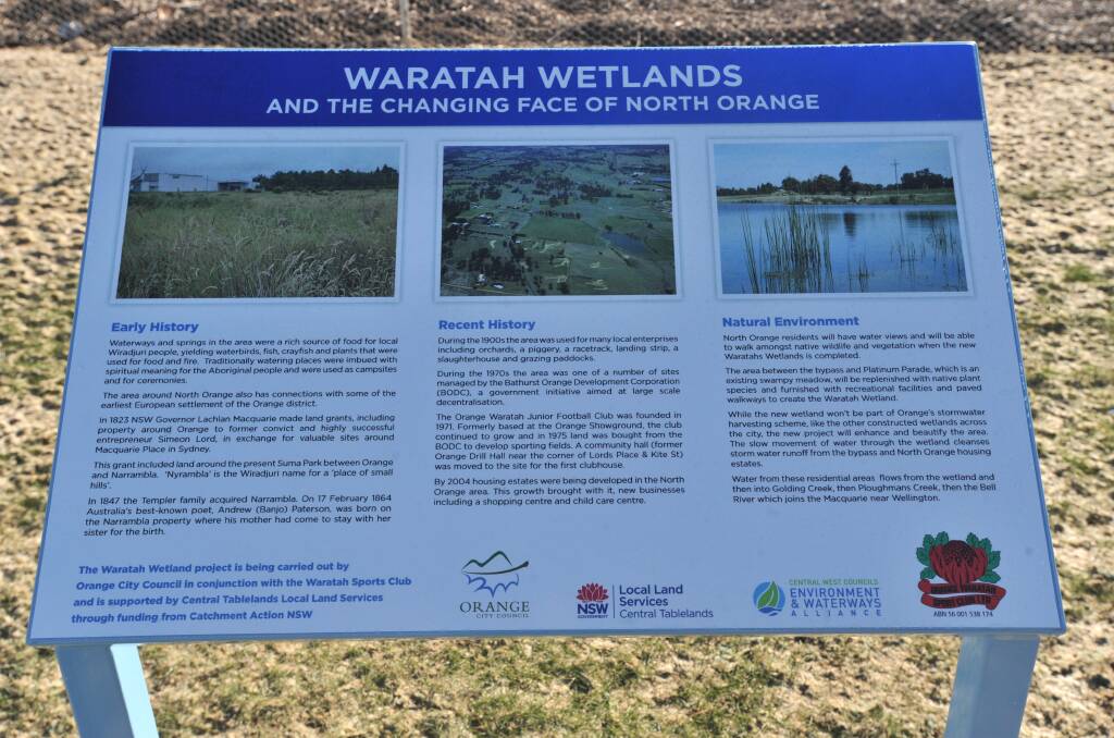 SIGN OF THE TIMES: An information panel has been placed at the site. Photo: JUDE KEOGH 0727jkwetlands1