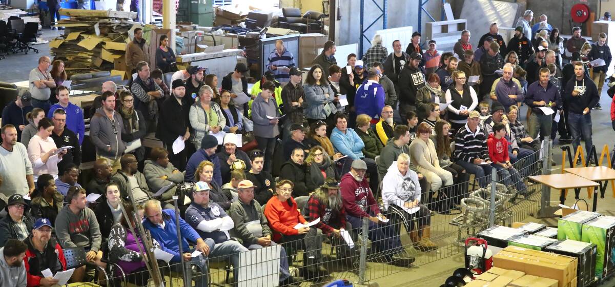 EYES ON THE PRIZE: A big crowd attended the auction seeking a bargin buy. Photo: PHIL BLATCH 0813pbauction2