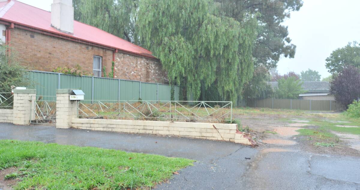 LONELY: There is a fence, a letterbox and not much else at 97 Hill Street. Photo: JUDE KEOGH