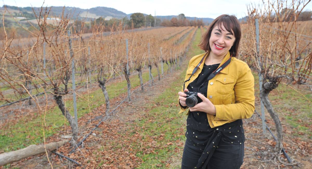 ON THE BOARD: Luisa Machielse in the vineyard where she took the Monopoly shot. Photo: JUDE KEOGH 0615jkborrodell1