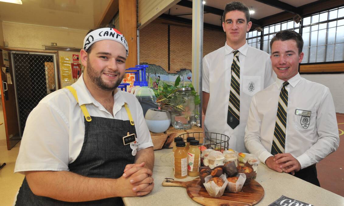 RIGHT IDEA: Canobolas High canteen and catering manager Andrew Farley with school vice-captain Matt Gray and captain Mac-Reith Snare. Photo: JUDE KEOGH0321jkcanteen1