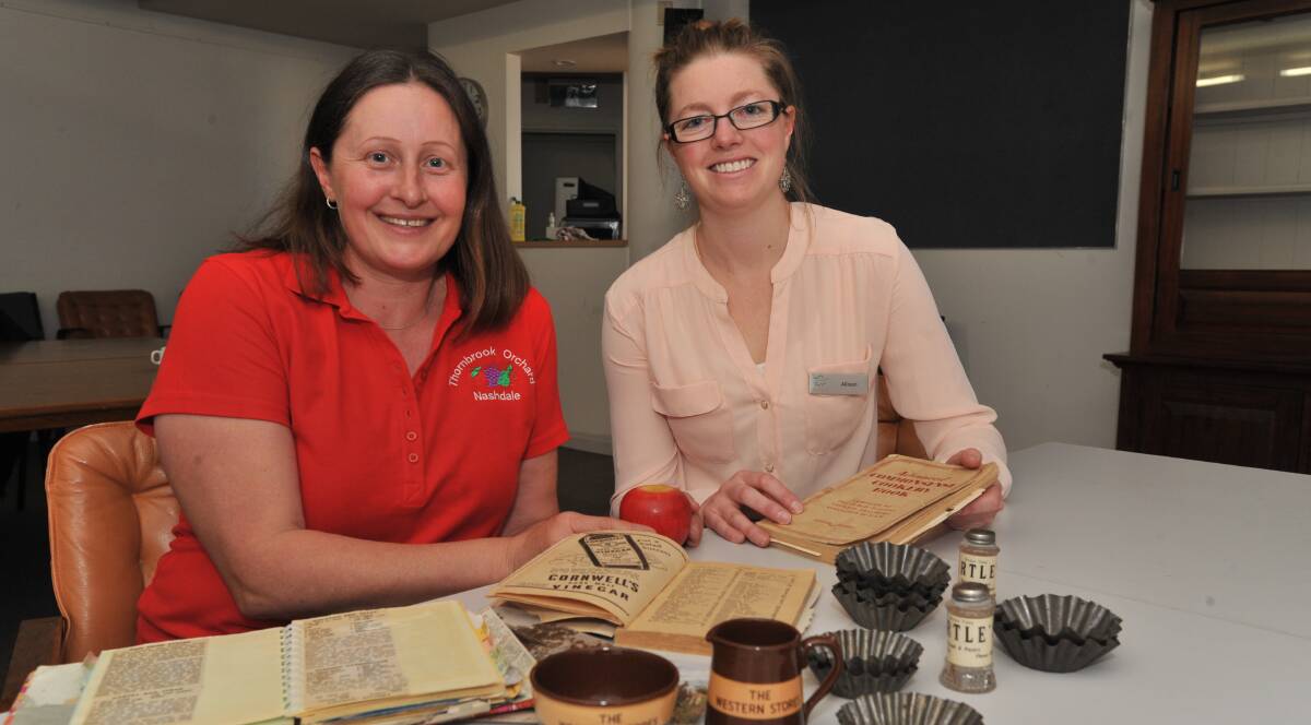 HERITAGE: Nashdale orchardist  Paula Charnock with Orange Regional Museum collections officer Allison Campbell. Photo: JUDE KEOGH 0613jkmuseum1