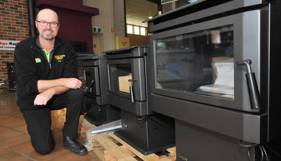 CLEANER CHOICE: Tilston's manager Paul Kingham with new wood heaters that have to meet stricter emission standards. Photo: JUDE KEOGH