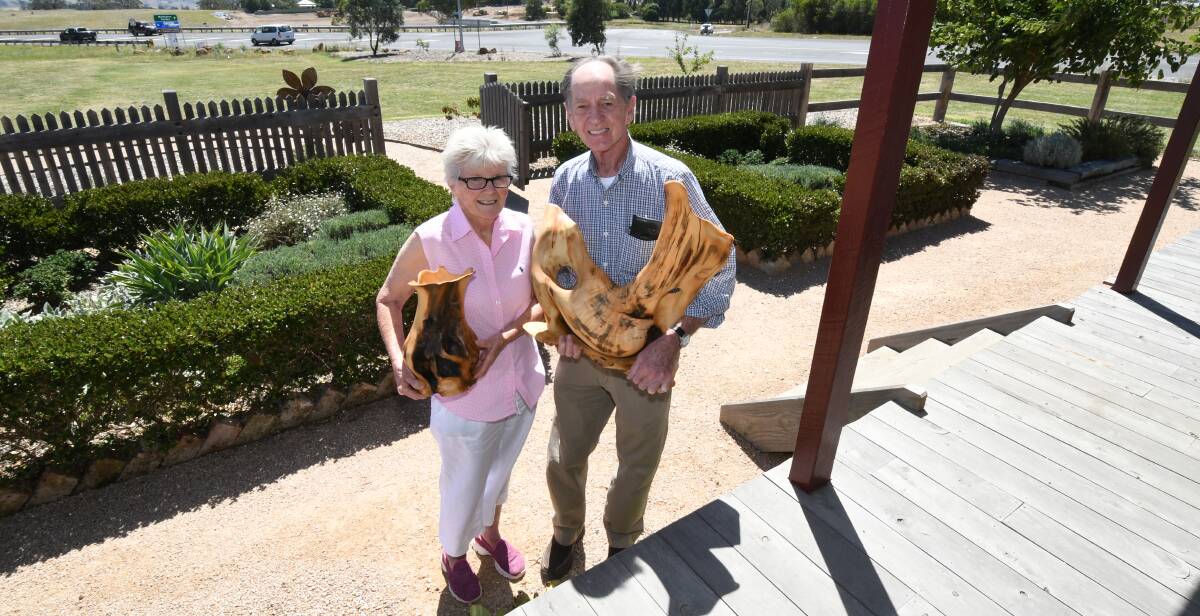 TIMBER TREASURES: Judi and Michael Francis with woodwork sculptures created from Huon pine they will be selling at Sunday's markets. Photo: JUDE KEOGH 0220jkmarkets2 