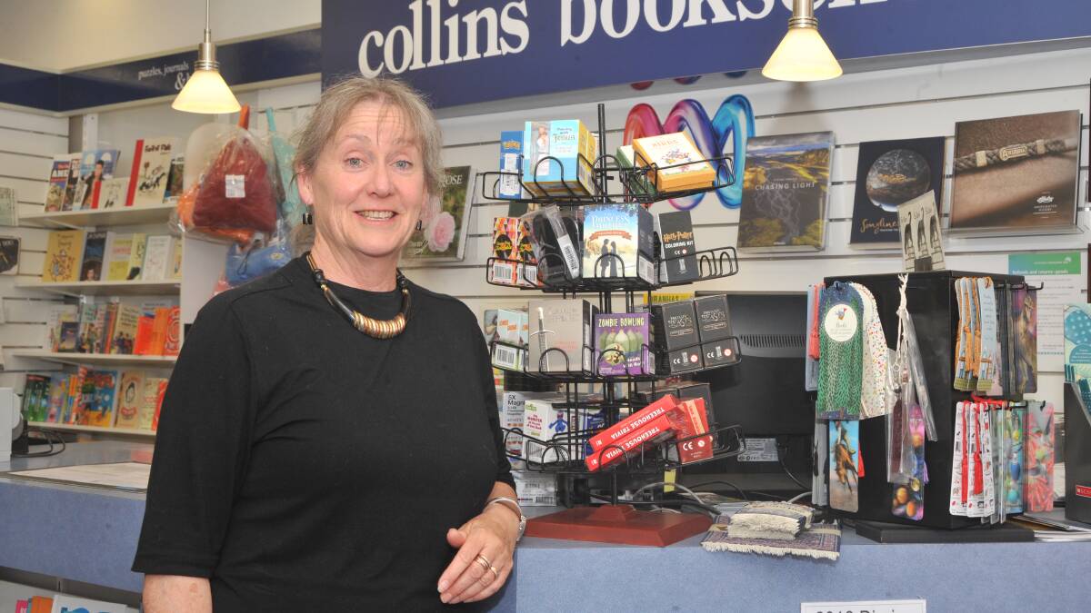 KEEN WORKER: Sue Tom works two days a week at Collins Booksellers in Orange. Photo: JUDE KEOGH 1017jkcollins1