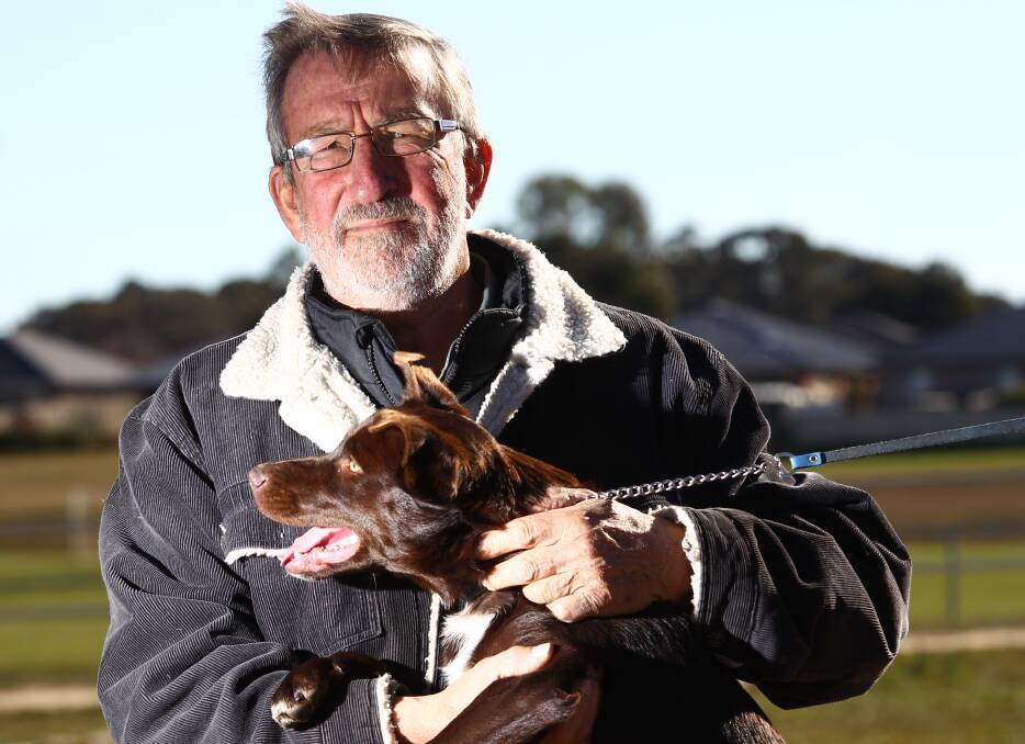 POOCH PAL: John Wills has been president of the Orange and District Kennel and Obedience club for 20 years. Photo: PHIL BLATCH 0625pbwork1