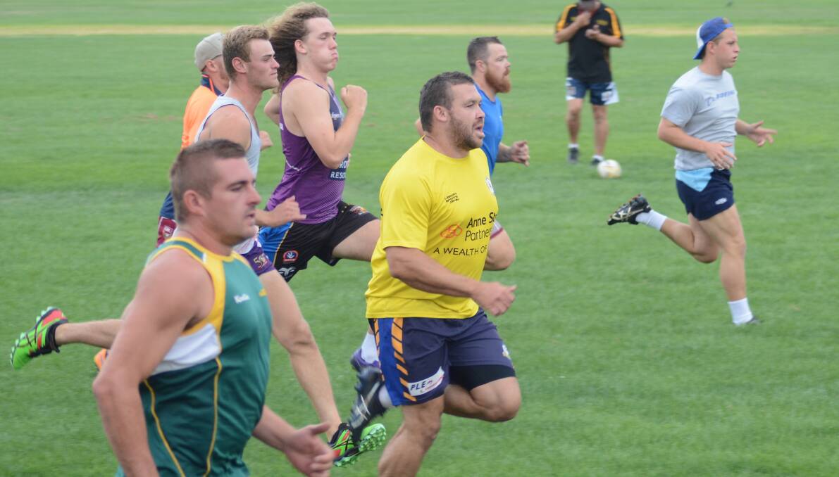 HIGH INTENSITY: Captain-coach Will Ingram (centre) takes his Bears through a bit of  interval training on Tuesday night. 