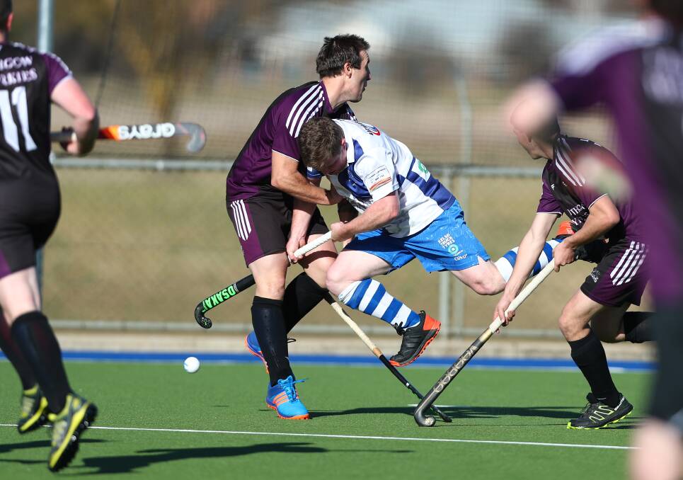 BLOCKED: Saints coach Shane Conroy clatters into a Panthers rival during Saturday's major semi-final. Photo: PHIL BLATCH