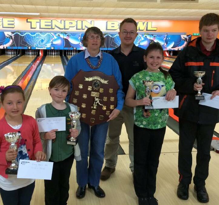 WINNERS ARE GRINNERS: Dave Solling winners (front, left) Ebony Tobin, Ben Smith, Leah Martin and Jayden Underhill and (back, left) Jenny Solling and Aaron Wright. 