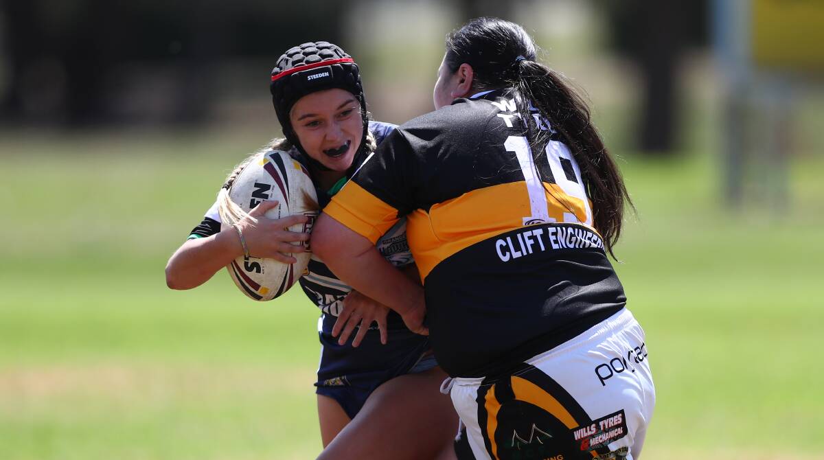 BANG: Orange Hawks half Alex Kennedy attempts to avoid this Oberon defender during the two blues' latest round of the CRL Western Nines competition. Photo: PHIL BLATCH