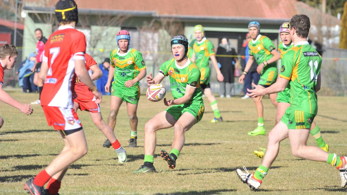 FOLLOW ME: CYMS' under 16s halfback Lachie Griffith goes to the line in his side's clash with Mudgee in the final. Photo: JUDE KEOGH