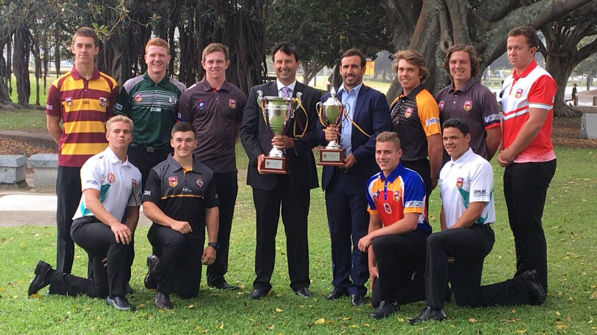 CUP OF LIFE: Andrew Johns and Laurie Daley with their respective cups and members of each country region. Photo: ADAM KIDD