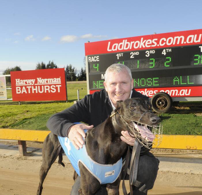 QUICK BLOKE: Owner and trainer Steve Jones with Local Bloke after his win in the Buck Fever @ Stud Stakes (520 metres) at Kennerson Park on Monday. Photo: CHRIS SEABROOK 091916cdogs1a