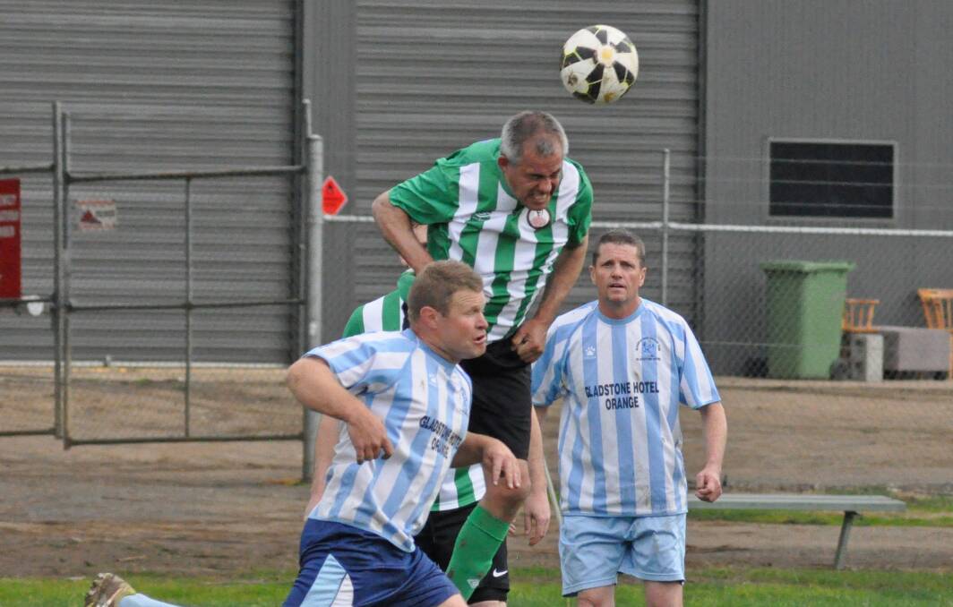 Brighouse defender Rob Biviano leaps high to head the ball past Gladdyatahs attackers Sam Gillespie and Tony Slingsby.