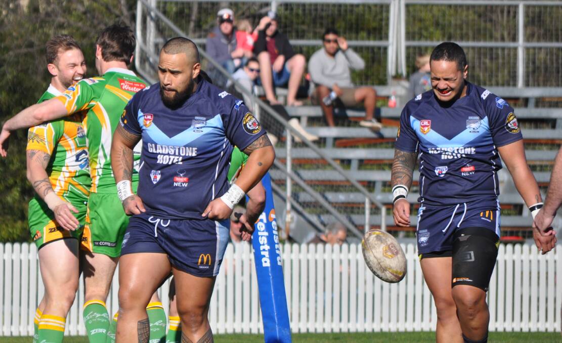 FIRST OF MANY: Orange Hawks duo Sam Sotogi and Viani Falaniko wince after CYMS first try in the derby - they went on to score 15 more. Photo: NICK McGRATH