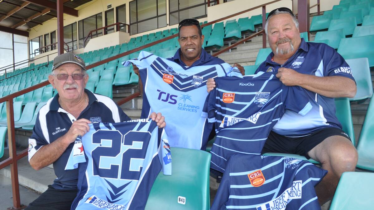 HELPING HAND: Hawks Barry Goodlock, Stan Tulevu and Andrew Blimka with some of the jerseys the club is donating to Fiji. Photo: NICK McGRATH