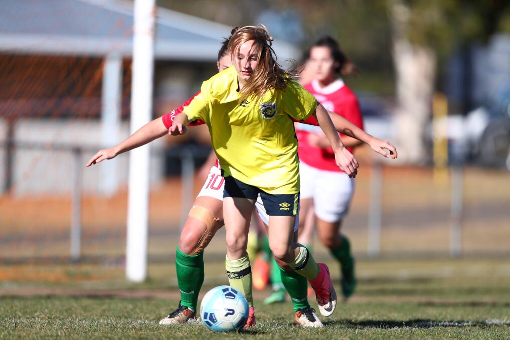 HAIR RAISING: Cushla Rue on the ball for the Mariners against St George at Jack Brabham Park. Photo: PHIL BLATCH
