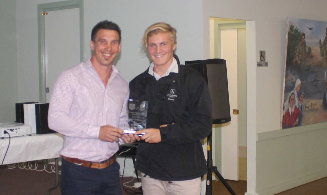 ALL SMILES: Western Rams' under-16 coach Jamie Szczerbanik and gun backrower Hudson Spicer, who was awarded the team's players' player award at Molong on Saturday night. Photo: contributed