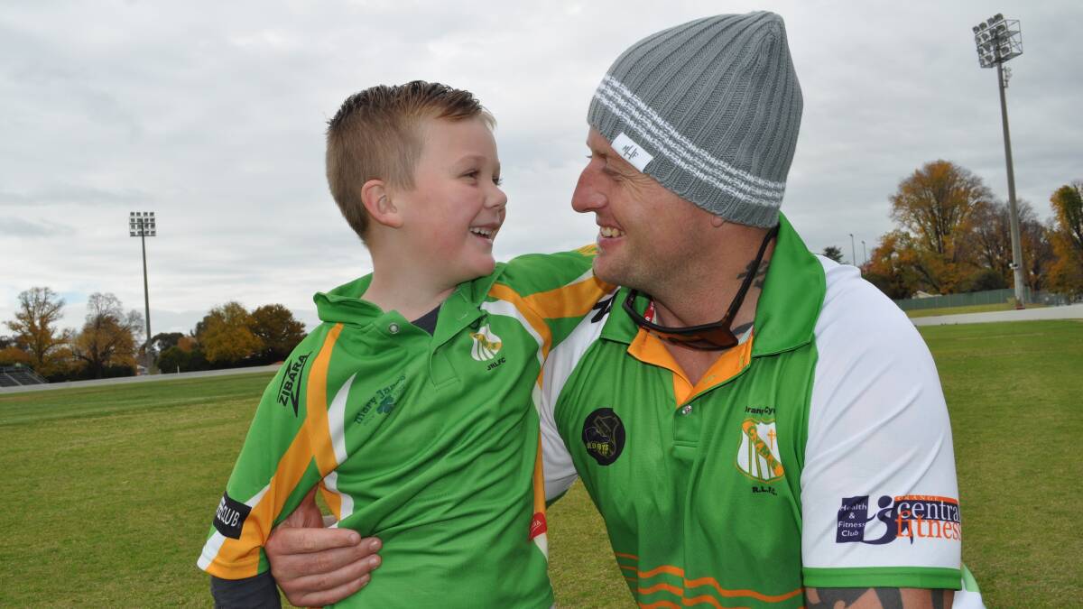 ALL SMILES: Big Chris Bamford and his son Lachy are loving life in Orange. Photo: NICK McGRATH