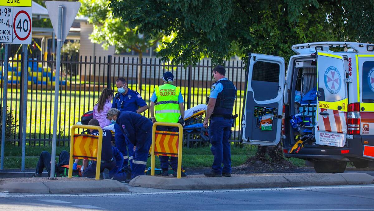 ACCIDENT: Paramedics attend the scene of the accident on Anson Street on Monday morning. Photo: TROY PEARSON/TNV