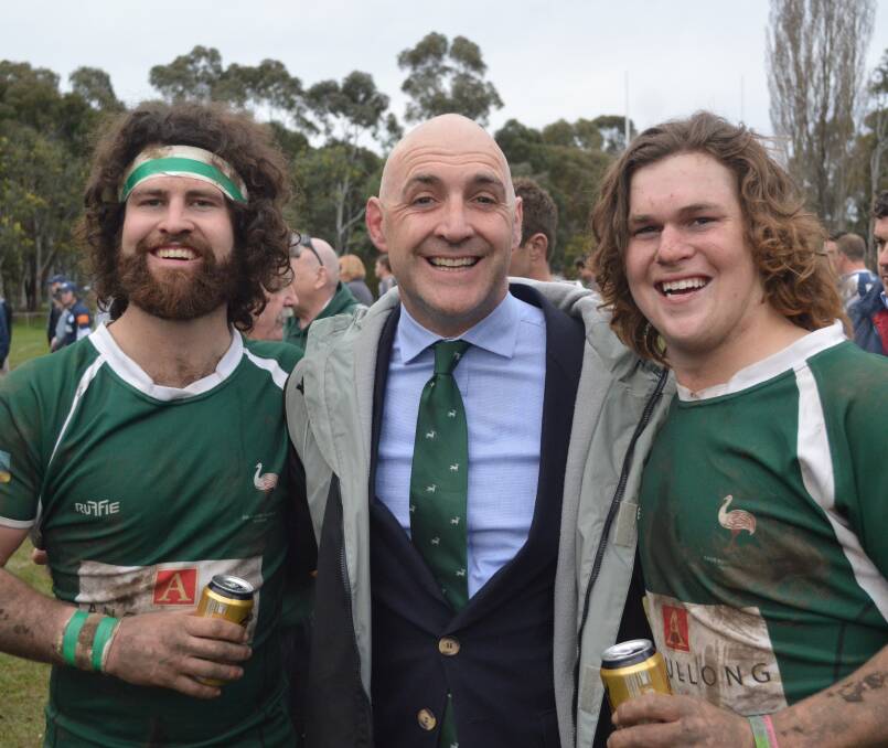 ALL TOGETHER NOW: Andrew Logan (centre), pictured with Tom Green and Sam Green  after the decider win. Photo: MATT FINDLAY