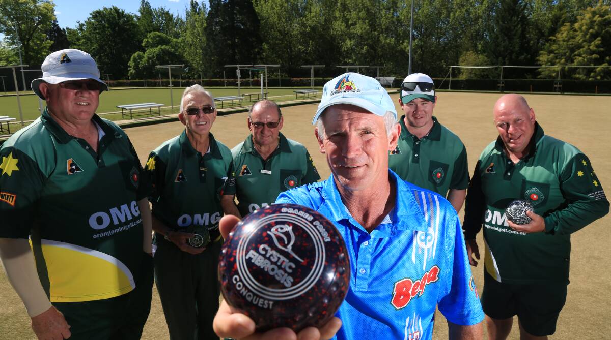 FOR A GOOD CAUSE: Neville Seaton, Graham Bradley, Norm Wilson, Ricky Holt (front), Brad Roberts and John Wilkins at Orange Bowling Club. Photo: PHIL BLATCH