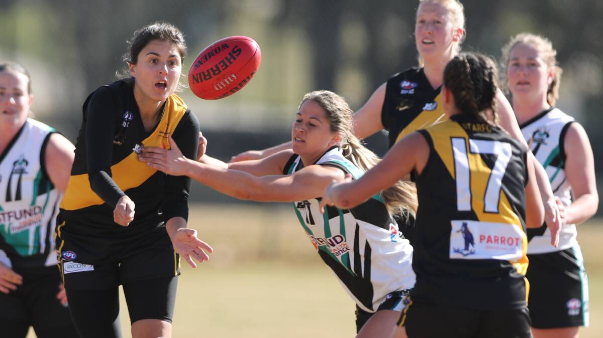 SEASON OVER: Aspasia "Spice" Manos and the Orange Tigers girls. The 2021 AFLCW season has been cancelled. Photo: PHIL BLATCH