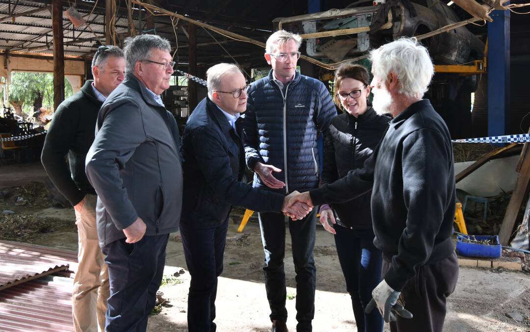 From left, Phil Donato (Orange MP), Kevin Beatty (Cabonne mayor), Anthony Albanese (Prime Minister), Dom Perrottet (NSW Premier), Steph Cooke (NSW Minister for Flood Recovery) and Greg Agustin, Eugowra business owner, in November. Picture by Carla Freedman.
