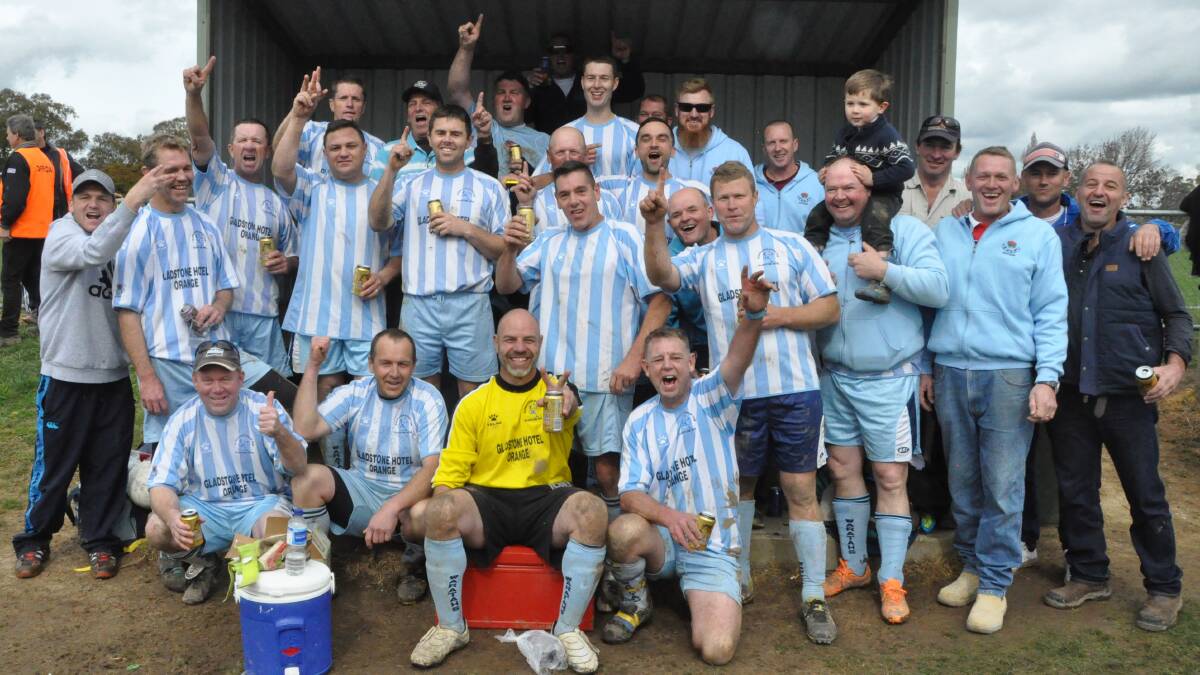 Winners are grinners as Gladdyatahs celebrate their extra-time win over Brighouse in the Orange over-35s football grand final.