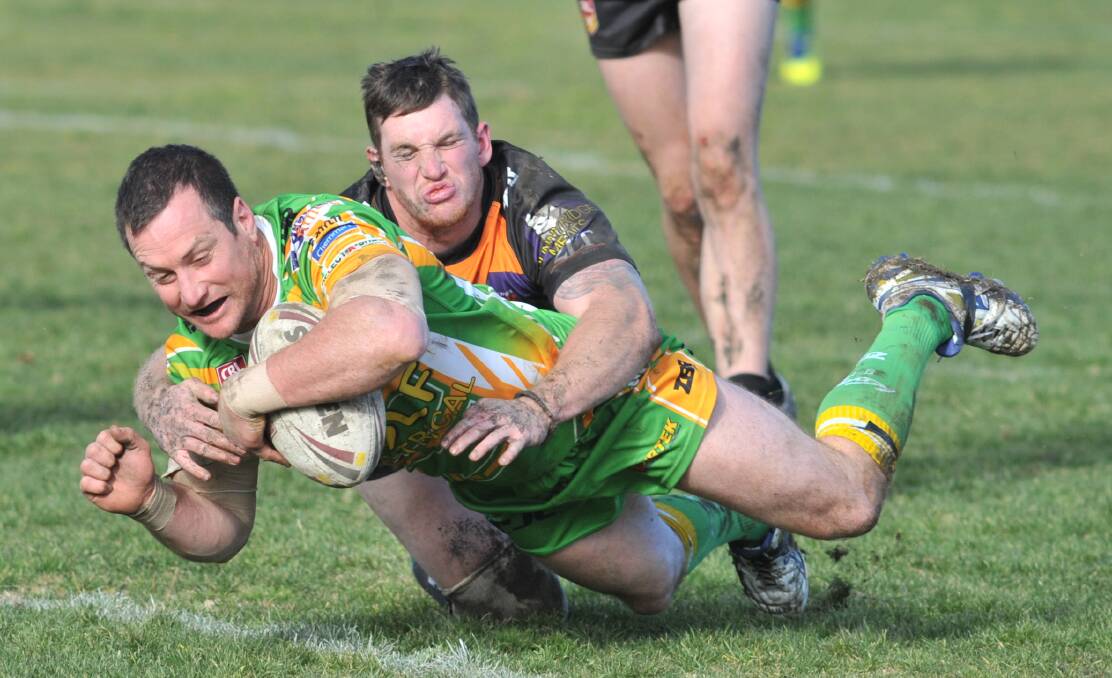TRY TIME: Wynne dives over for a rare try during CYMS' big win over Lithgow mid-season. Photo: JUDE KEOGH