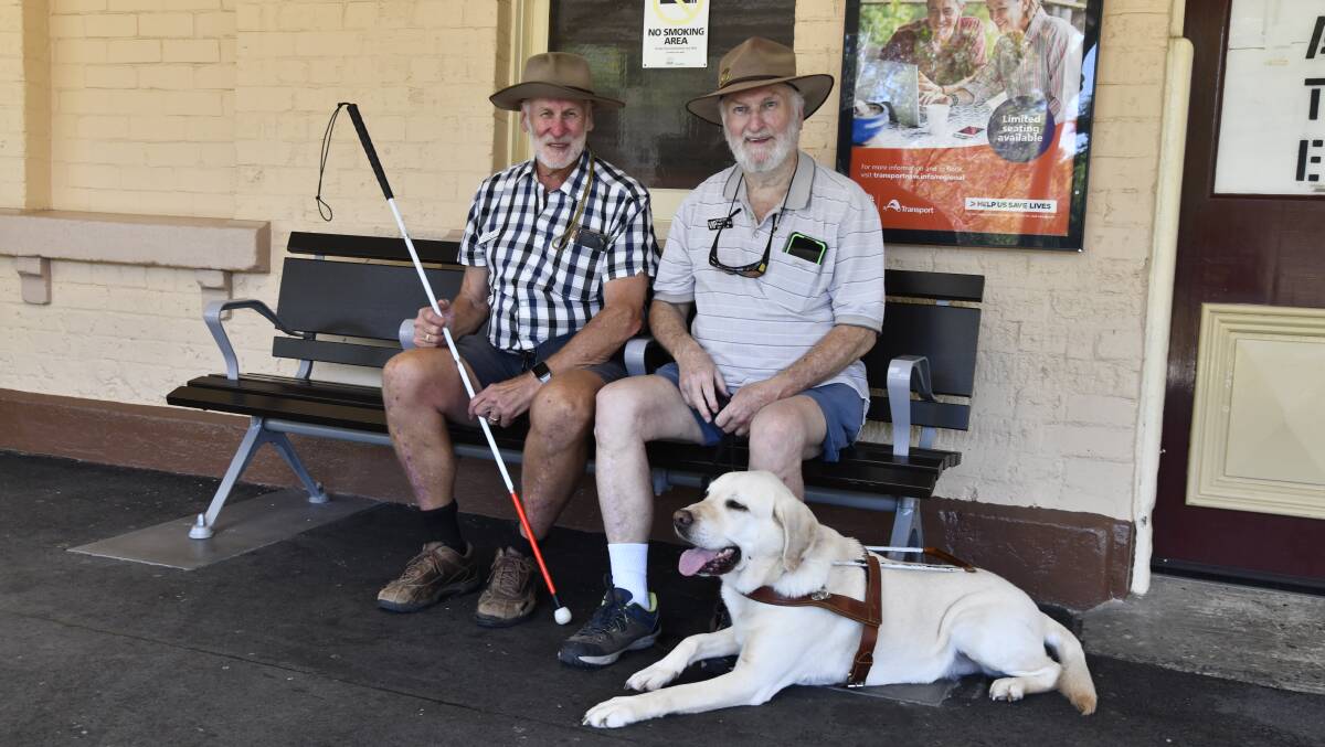 Colin Spicer, Doug Spicer and good boy Rusty Spicer at the Orange Train Station in 2023. Picture by Carla Freedman