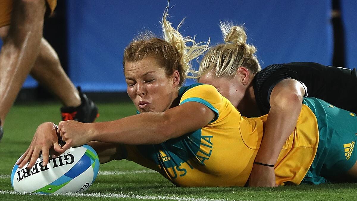 Controversial try awarded: Emma Tonegato touches down in the gold medal match against New Zealand. Pic: Getty Images