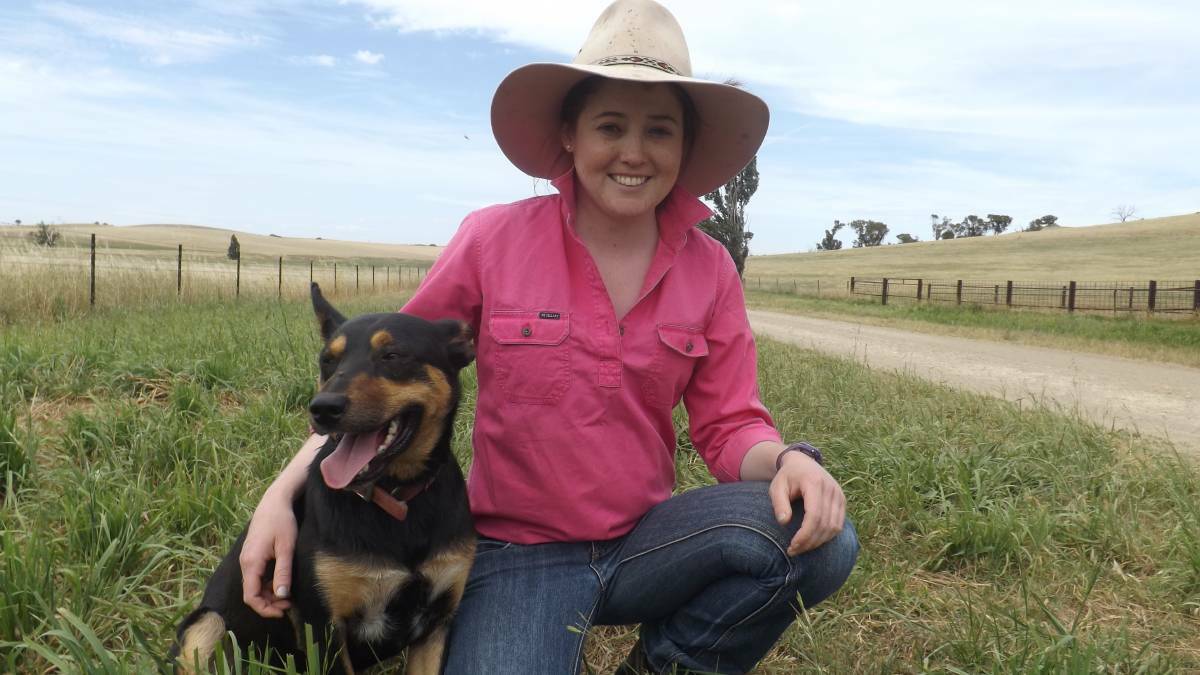 Lauren Goldsworthy on the family farm with her dog, Tim, nearly one year after receiving a double lung transplant. Picture: Supplied