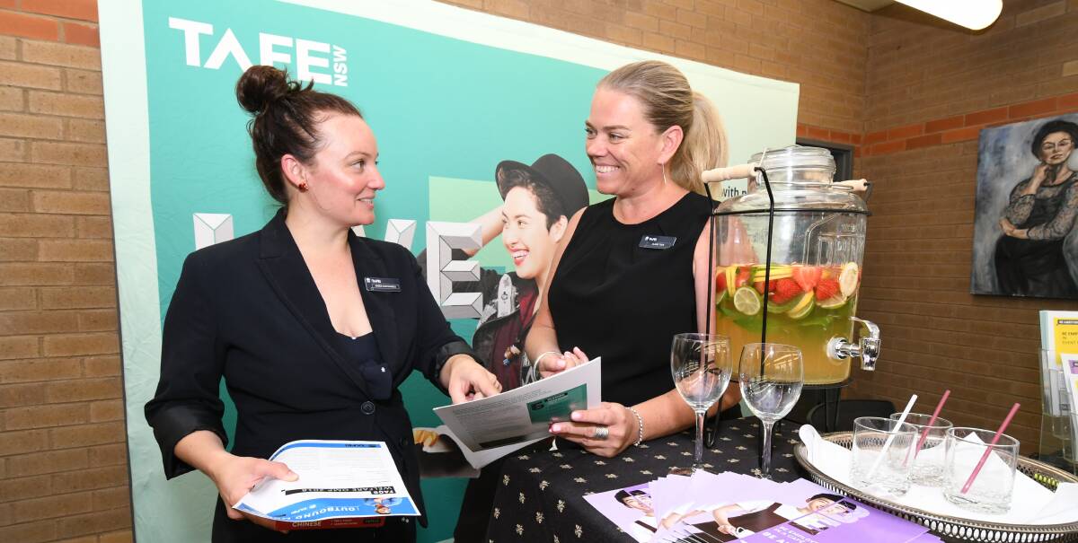 ENROLMENT DAY: TAFE international projects officer Amber Mastrangeli and hospitality and events teacher Claire Tuck discuss inquiries at the open day as part of the enrolment week. Photo: JUDE KEOGH