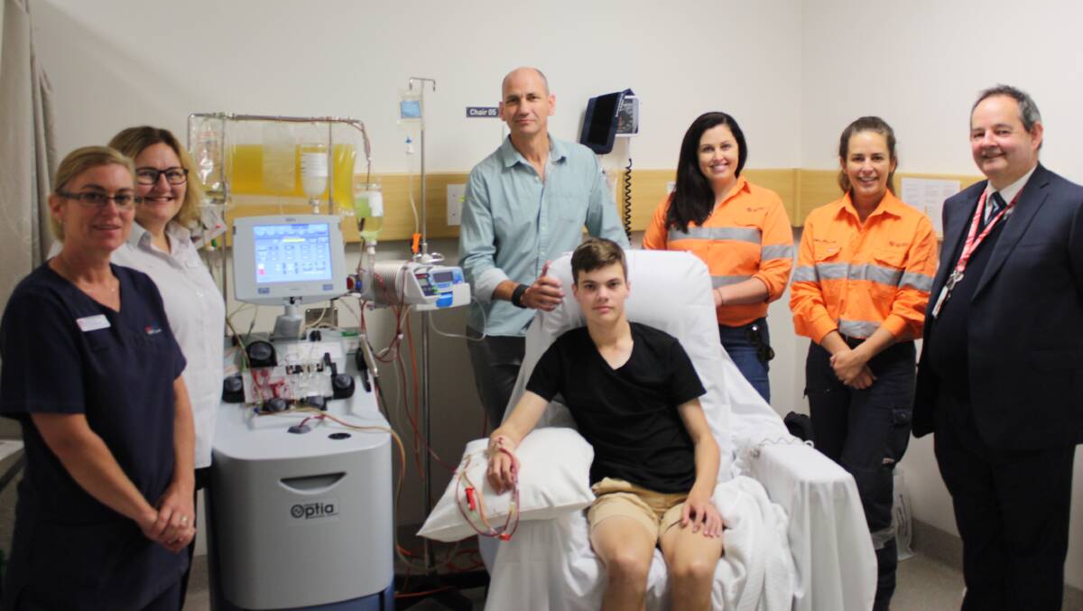 LIFE CHANGING MACHINE: Registered nurse Mel Laird, nursing unit manager Karen Fogo, James Wickham and his son Kyle Wickham who will use the machine, Newcrest Cadia Valley Operations senior community relations specialist Melissa O’Brien and community relations officer Emma Pratten with haematologist Dr Doug Lenton. Photo: SUPPLIED