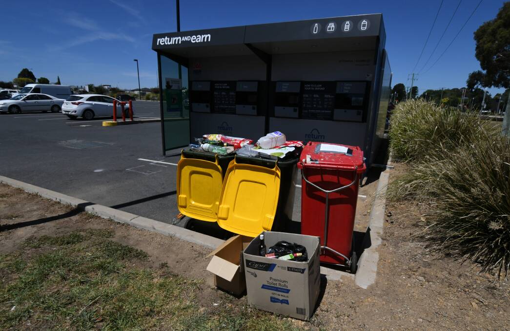 OVERFLOWING:  Bins have reached capacity with people throwing out boxes, bags and rejected bottles at the Return and Earn facility, which has already had to be emptied at the North Orange Shopping Centre. Photo: JUDE KEOGH