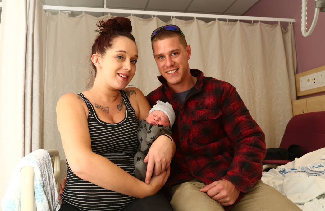 NEW MUM: Rebecca Price with her first child Tyran William Cain and partner Heath Cain. Photo: PHIL BLATCH