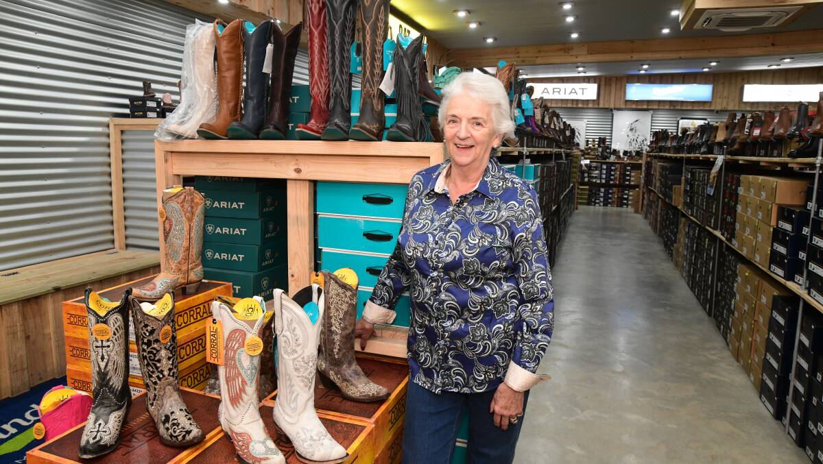 Lucknow Skin Shop and Boot Barn co-owner Dianne Gee with some of the many boots at the expanded business. Picture by Jude Keogh