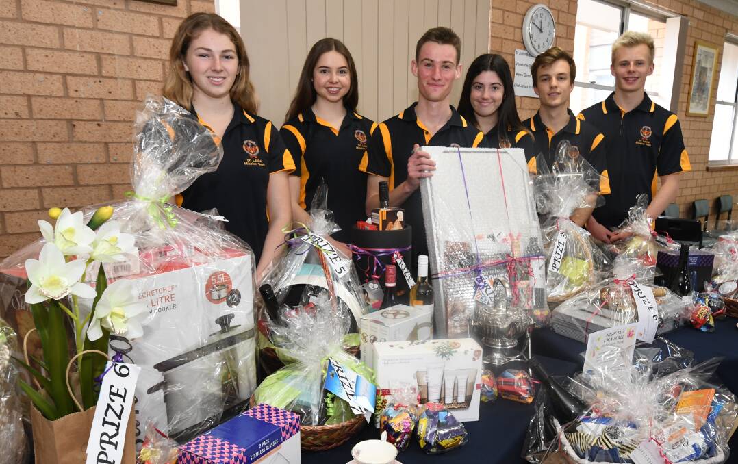 COMMITTED: Members with raffle items, Lucy Nagle, Monique Stansfield, Harry Robins, Jen Dwyer, Angus Barnes Rory Thornhill. Photo: JUDE KEOGH