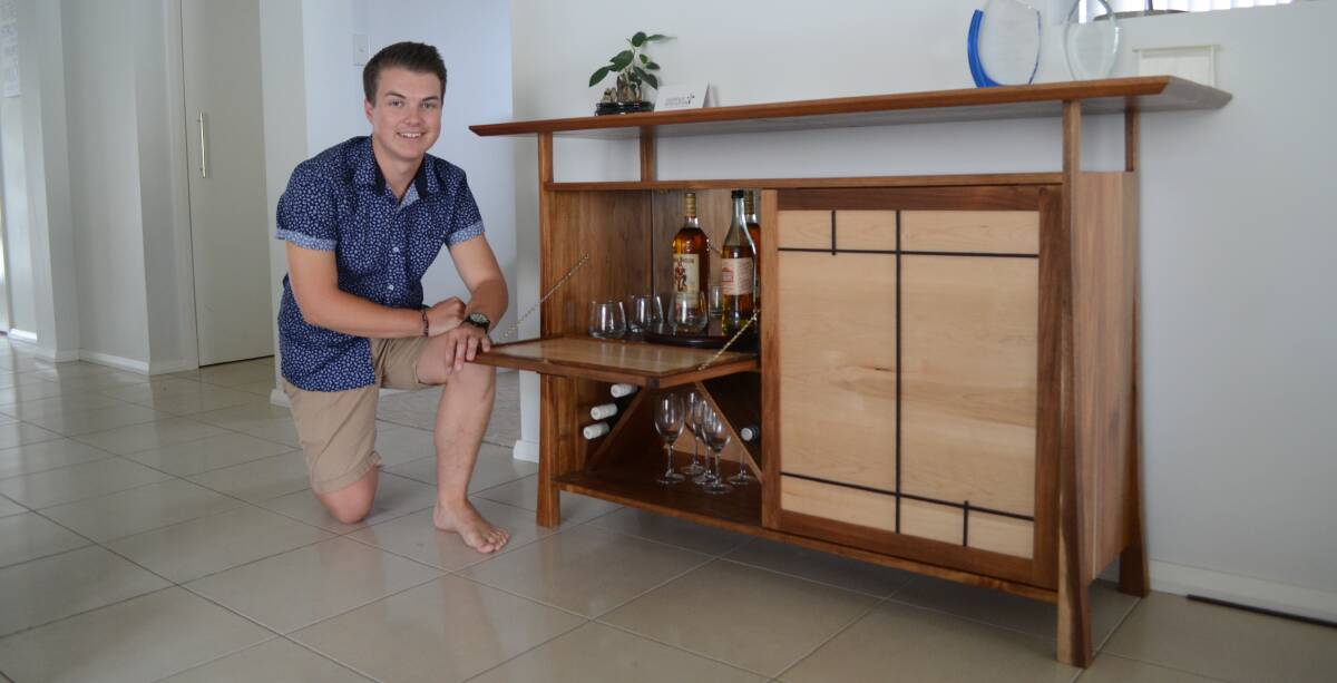 WELL CRAFTED: James Sheahan Catholic High School graduate Luke Kelly with his major woodwork project, which will be exhibited at Homebush. 