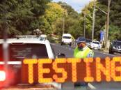 A file picture of a vehicle stopped at a police road side breath testing site. File picture