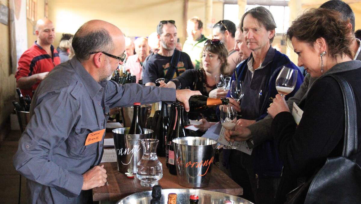 Strawhouse Wines owner Justin Byrne pouring glasses of wine at a previous Orange Wine Festival. Picture supplied