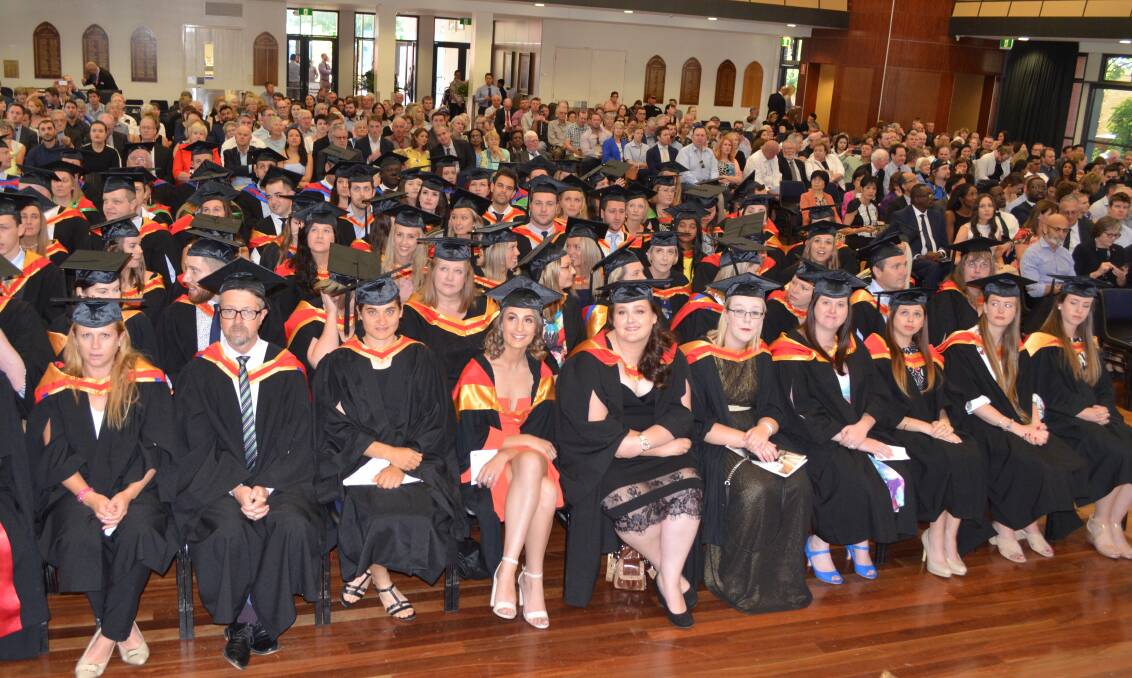 STUDIES ACHIEVED: More than 500 family and friends watched on as 144 students graduated from Charles Sturt University's Orange campus on Friday. 