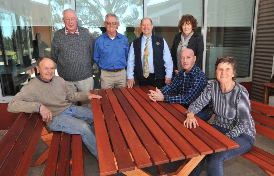 NEW FURNITURE: Orange woodworkers Ian Davey and Brian Collins, Orange rotarians Adrian Garton and George Weston with Western Care Lodge clients Carol Weston, Vince McAneney and Terese Dietrich. Photo: JUDE KEOGH