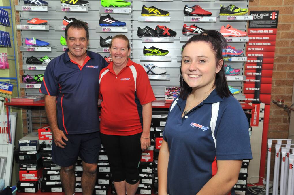 UP SIDE: Sportspower Orange owners David and Rhonda Russell with employee Georgie Watson who will benefit from penalty rate cuts with more Sunday shifts being able to be offered to her. Photo: JUDE KEOGH 0223jkrate1