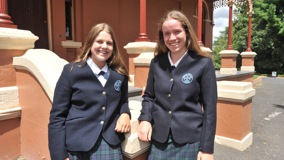 CLOSE TO HOME: Kinross Wolaroi School student Jen Quera and Addie Eastwood have raised money for people affected by the Sir Ivan Fire. Photo: JUDE KEOGH 0228jkkwsfire1