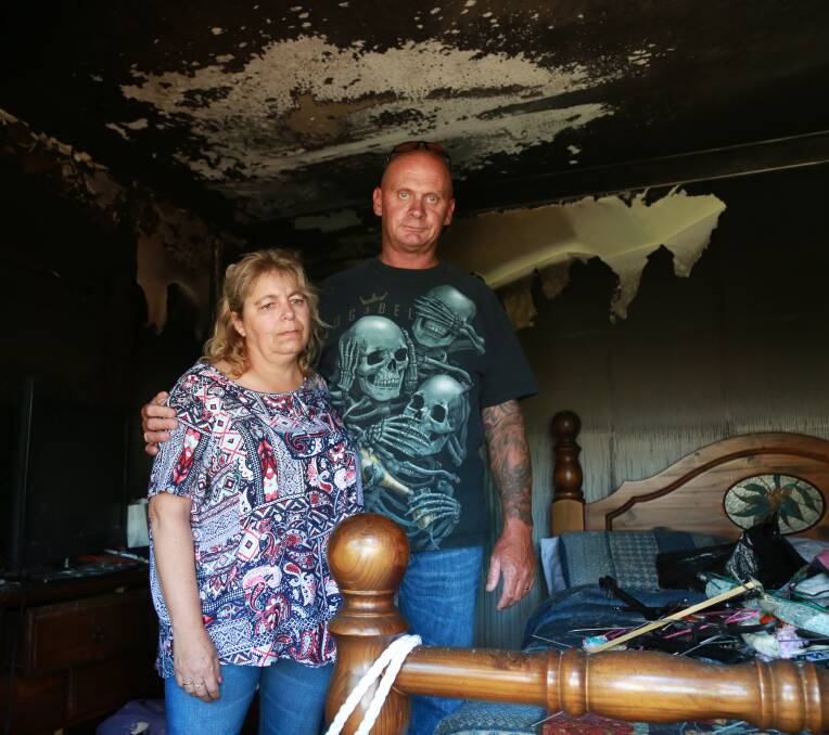 INSPECTING THE DAMAGE: Veronica and Matthew Fowler in their bedroom after Sunday's blaze.