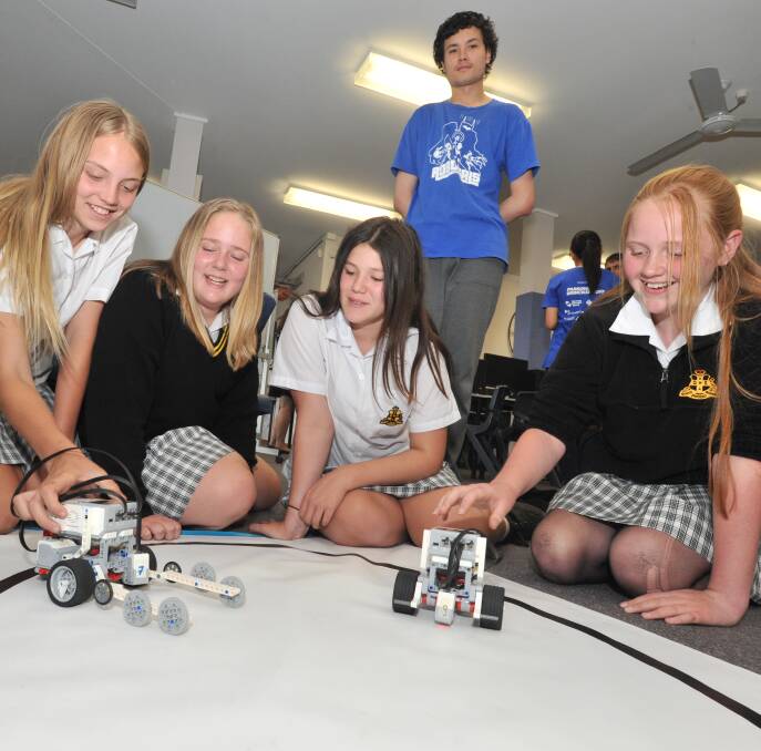 FRIENDLY RIVALRY: Chloe Parish, Georgia Reyer, Asiah Golaz, James Line and Isabella Wythes put their sumo robots into the ring for a battle. PHOTO: Jude Keogh