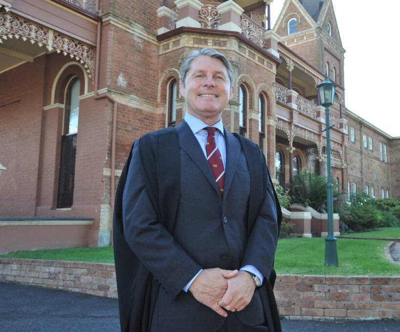 SCHOOL IS IN SESSION: New Kinross Wolaroi School principal Dr Andrew Parry has taught at the University of Oxford and the King's School in Parramatta. Photo: JUDE KEOGH 0130jkkws3